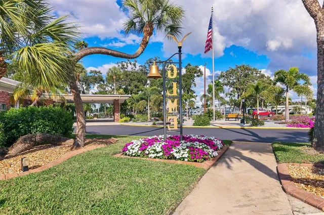a view of garden with flowers and trees