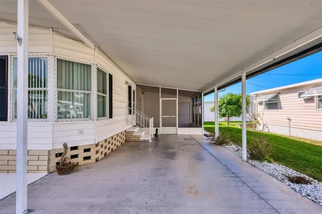a view of a house with backyard and porch