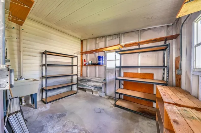 a kitchen with a table and chairs in it
