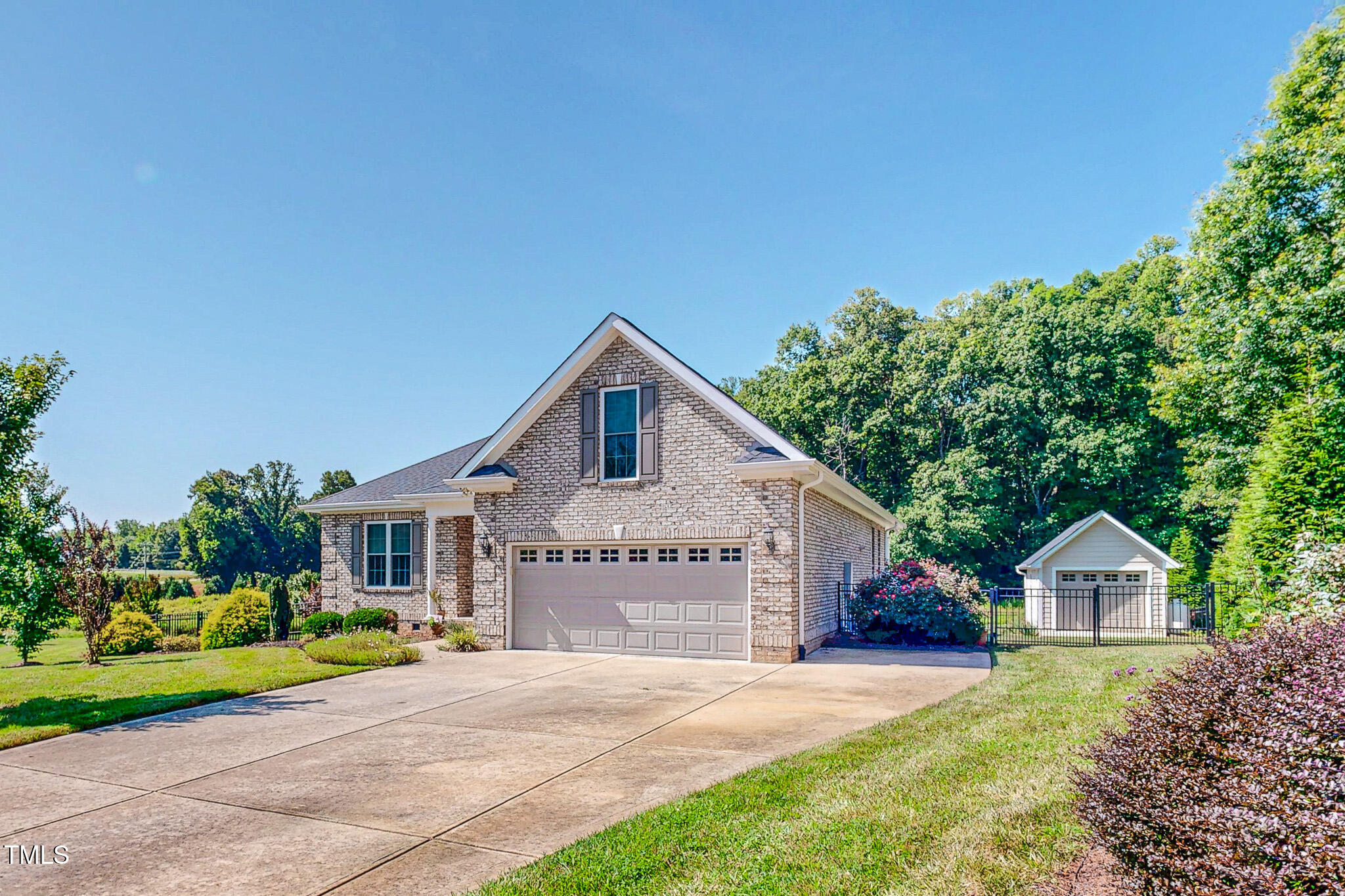 90 South Old Lantern Road Timberlake, NC 27583 - Photo 11 of 63 a front view of a house with a yard and garage