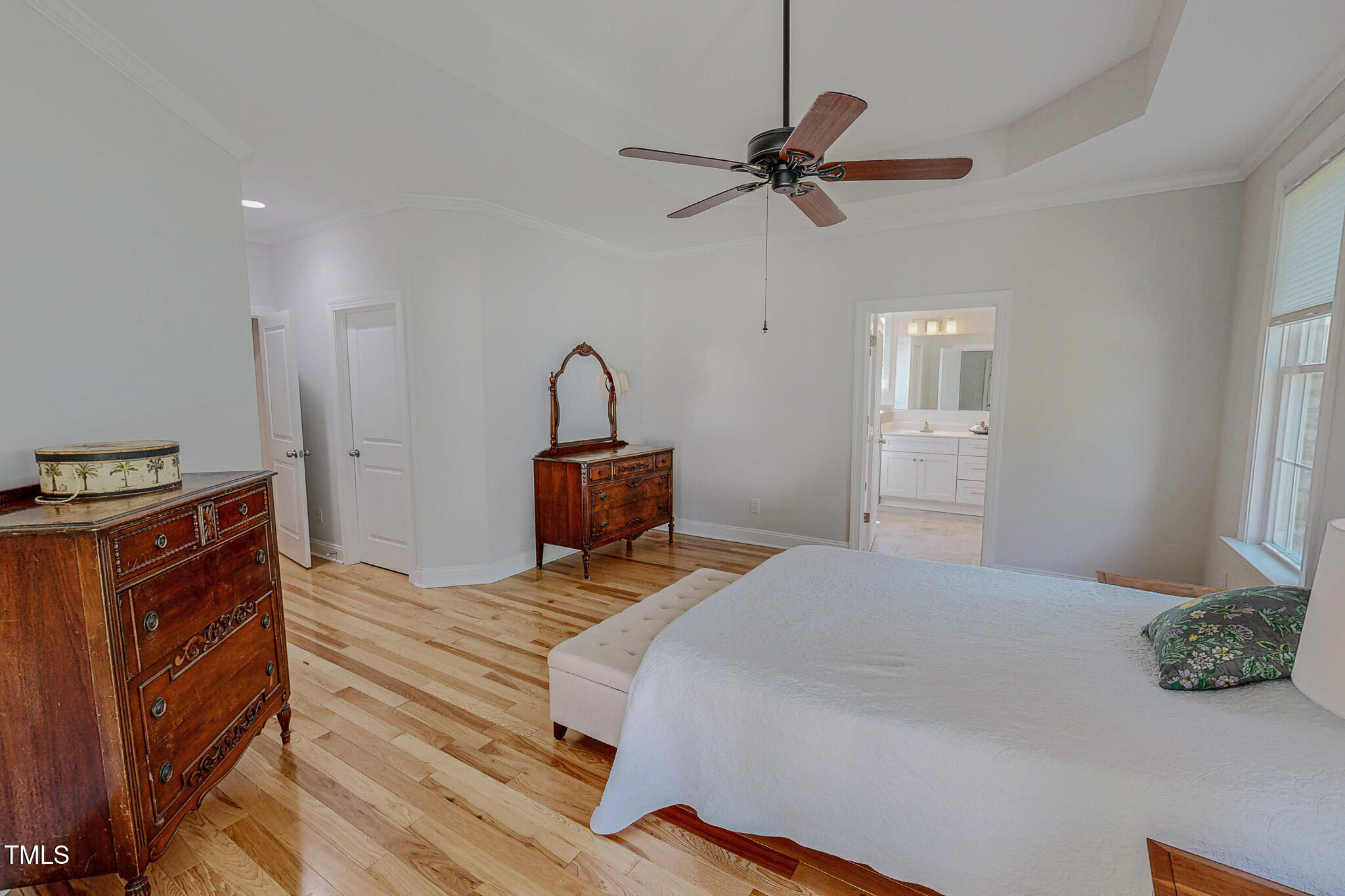 90 South Old Lantern Road Timberlake, NC 27583 - Photo 13 of 63 a bedroom with a bed and a chandelier