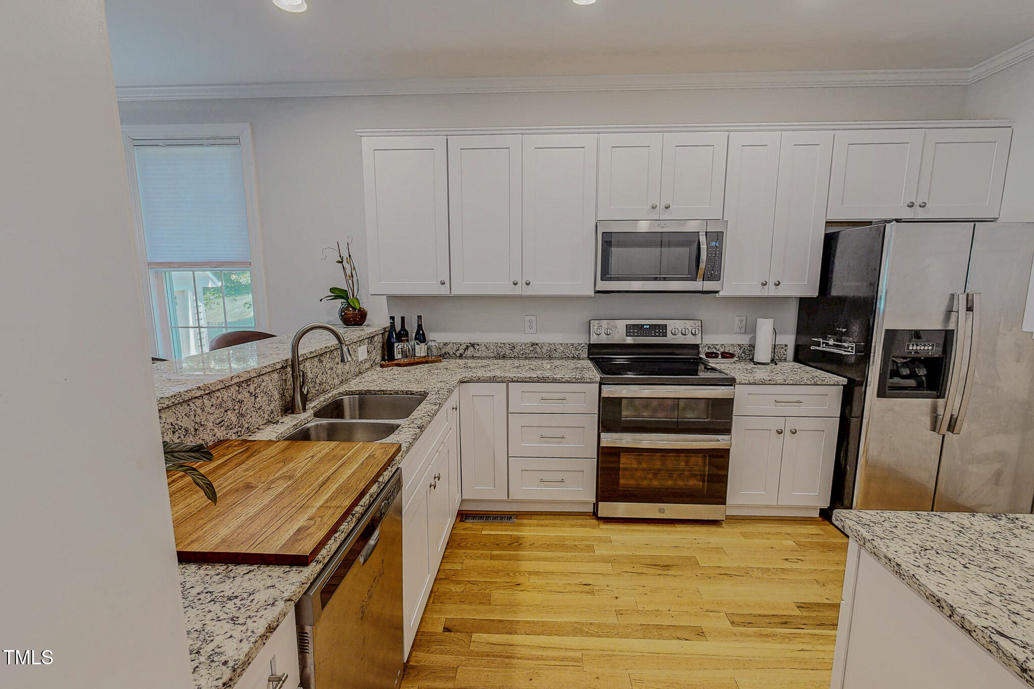 90 South Old Lantern Road Timberlake, NC 27583 - Photo 18 of 63 a kitchen with stainless steel appliances granite countertop a stove a sink and a refrigerator