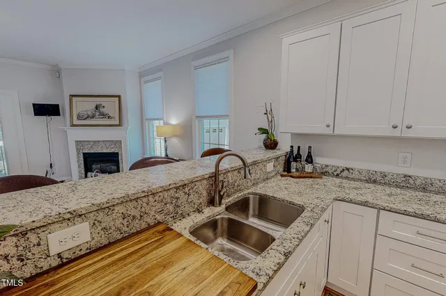 a kitchen with a refrigerator stove and sink