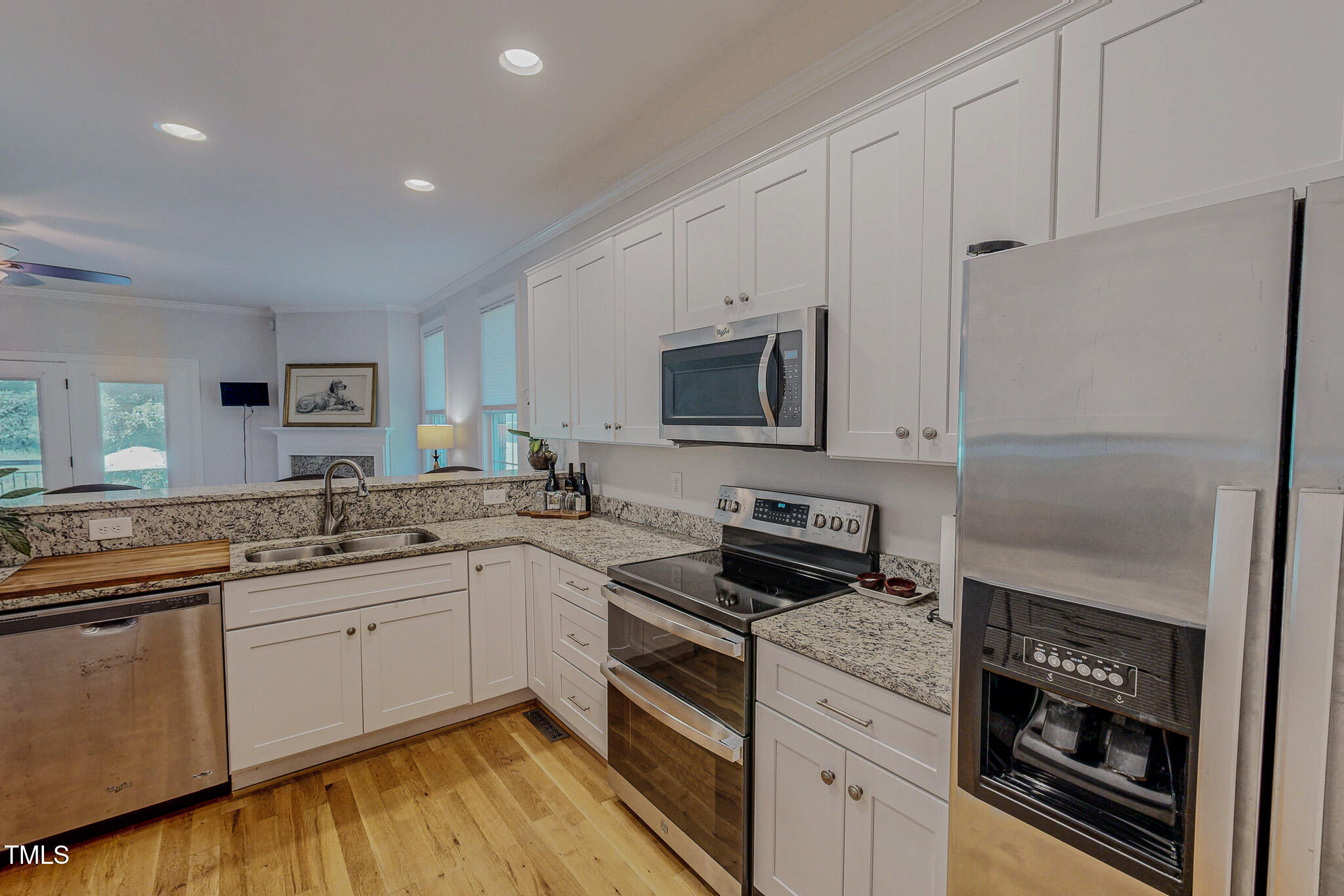 90 South Old Lantern Road Timberlake, NC 27583 - Photo 23 of 63 a kitchen with granite countertop a sink stove and refrigerator