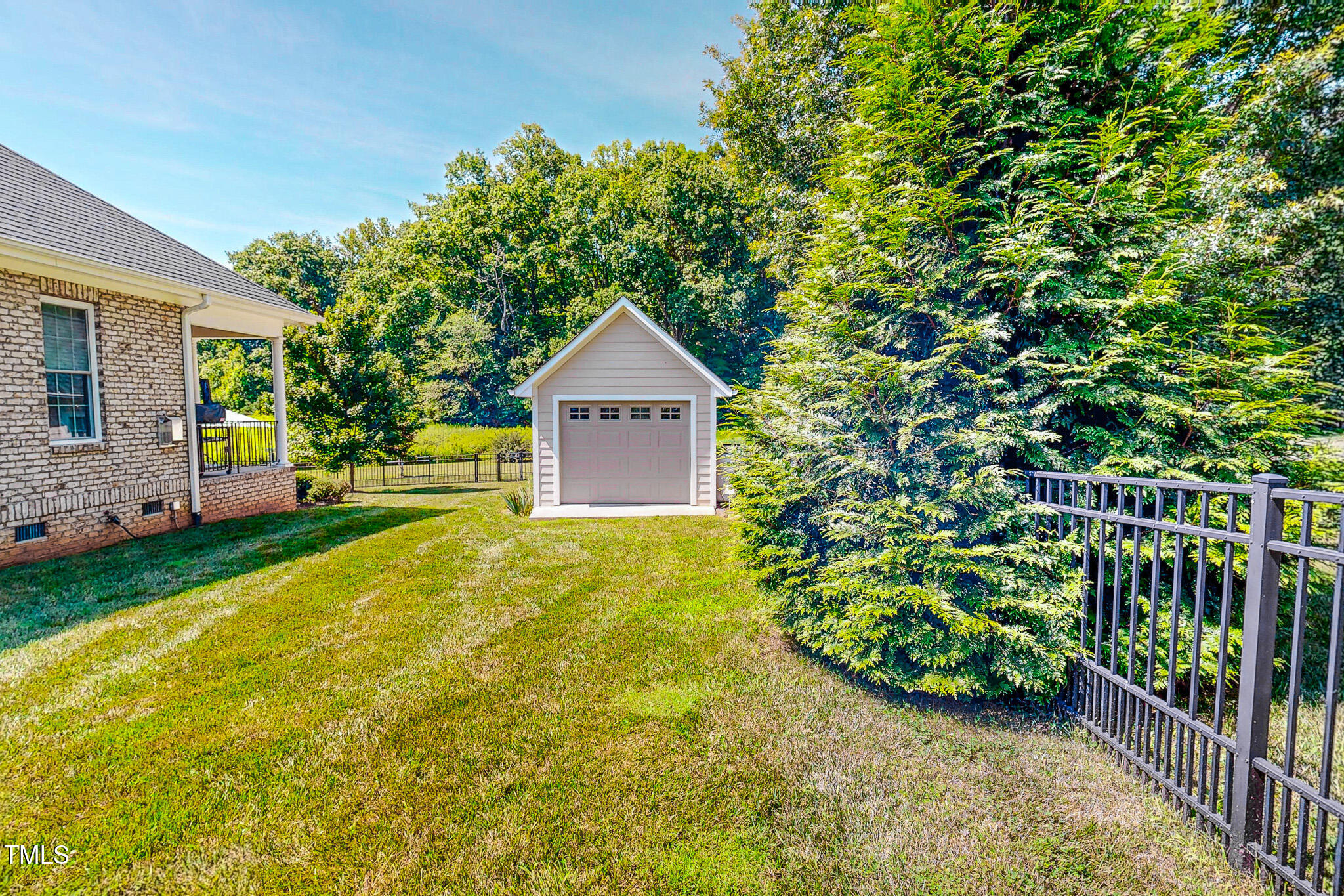 90 South Old Lantern Road Timberlake, NC 27583 - Photo 26 of 63 a front view of a house with garden