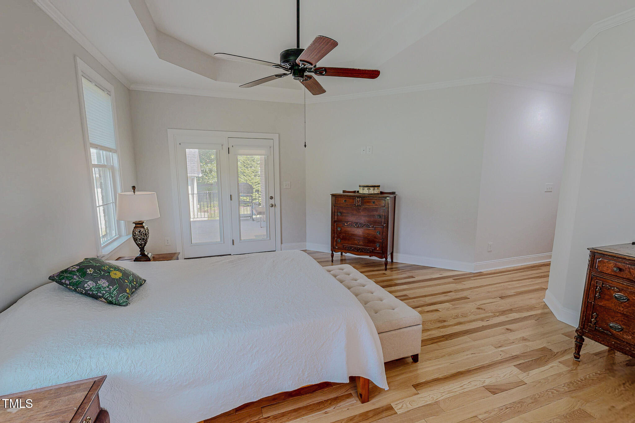 90 South Old Lantern Road Timberlake, NC 27583 - Photo 35 of 63 a bedroom with a bed and a chandelier