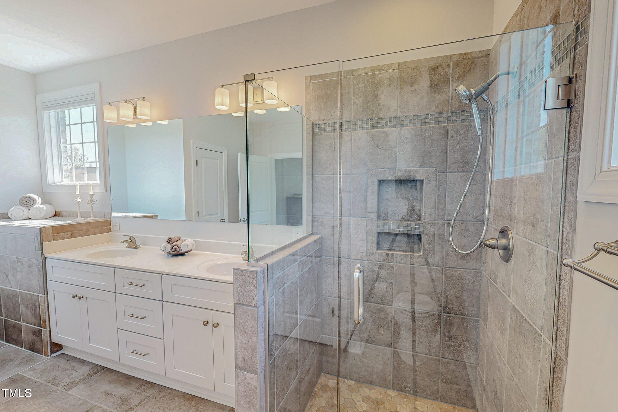 90 South Old Lantern Road Timberlake, NC 27583 - Photo 39 of 63 a bathroom with a double vanity sink mirror and shower