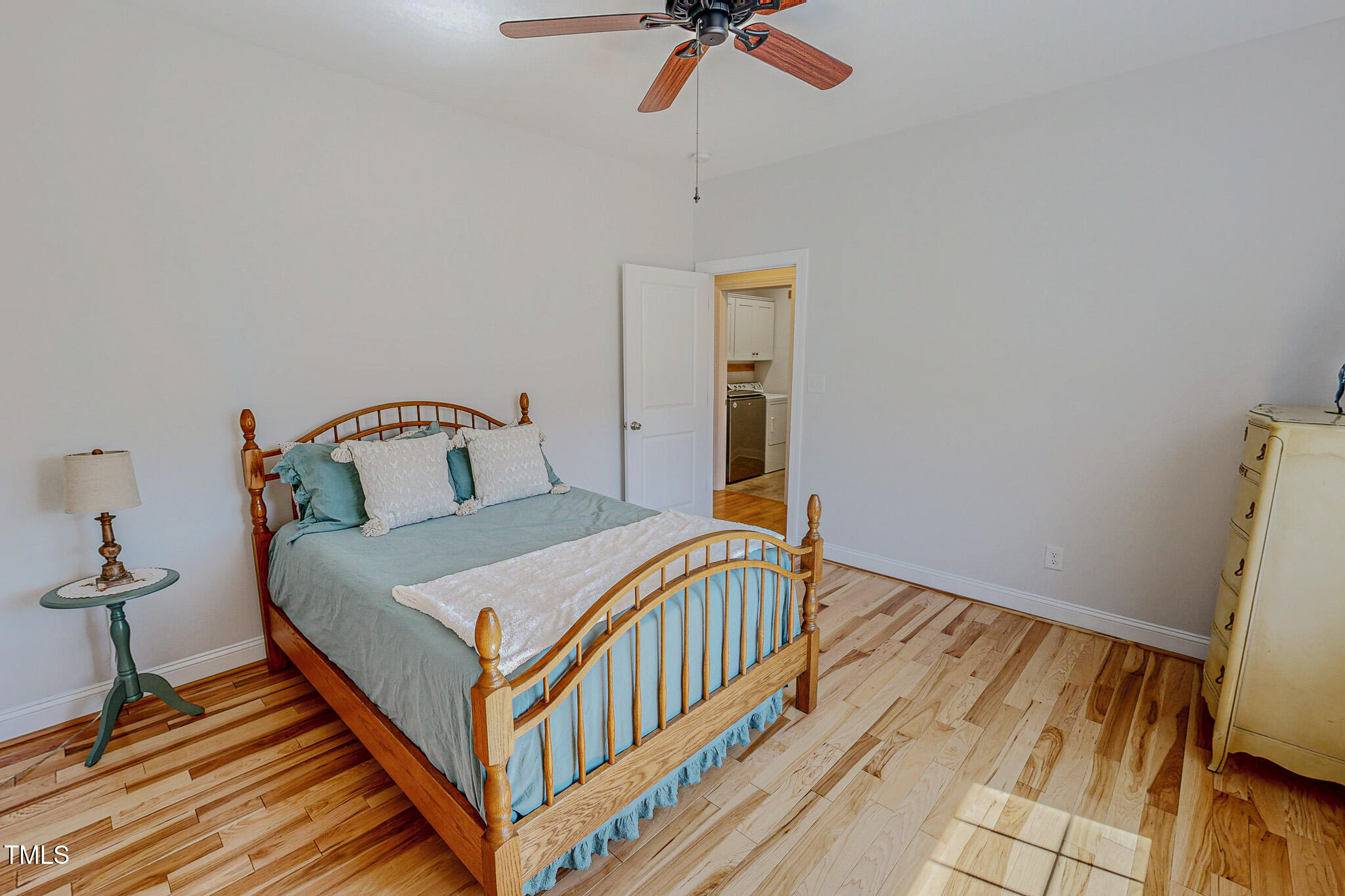 90 South Old Lantern Road Timberlake, NC 27583 - Photo 42 of 63 a bedroom with a bed and wooden floor