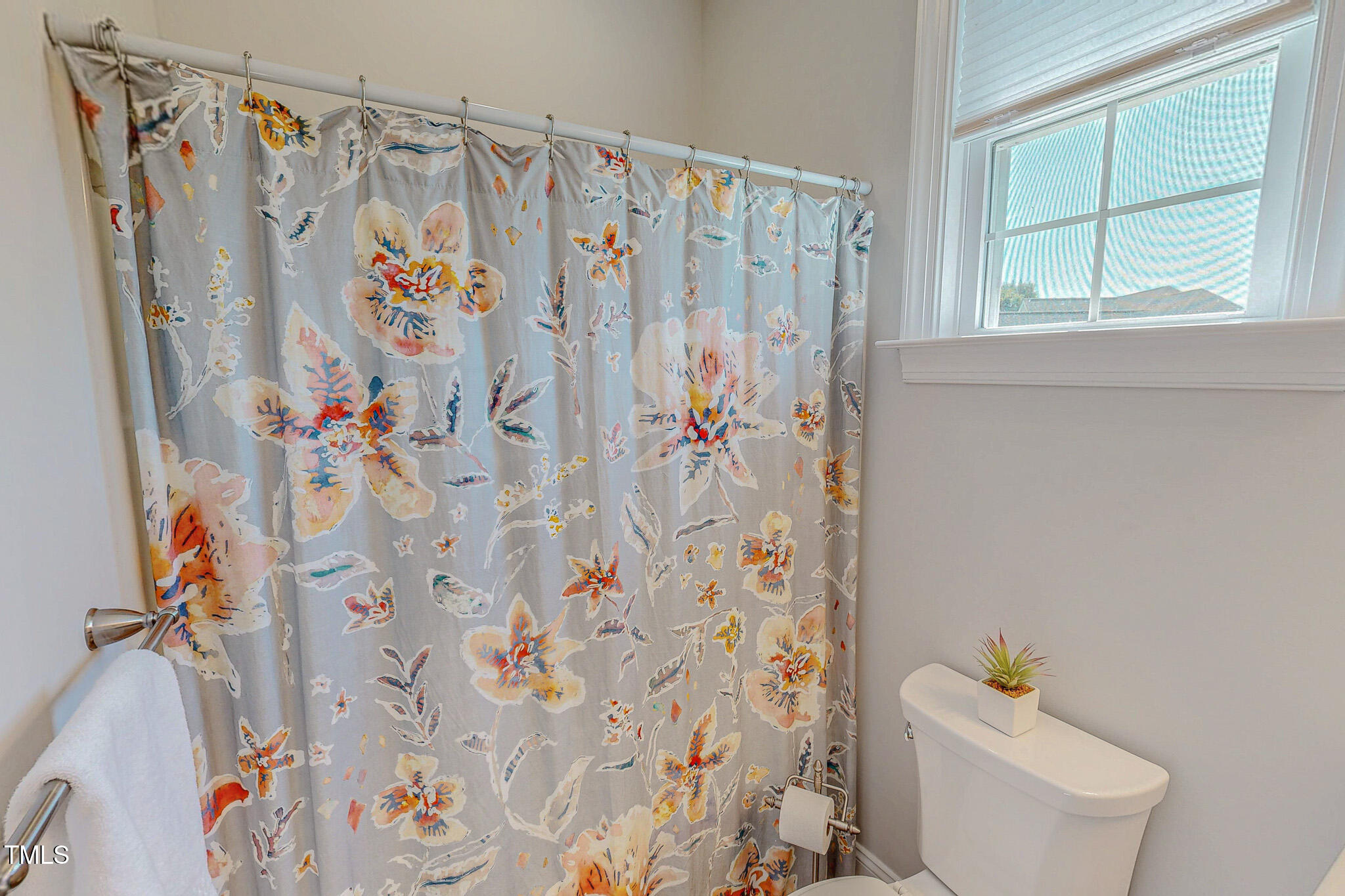90 South Old Lantern Road Timberlake, NC 27583 - Photo 46 of 63 a bathroom with a shower curtain and a curtain