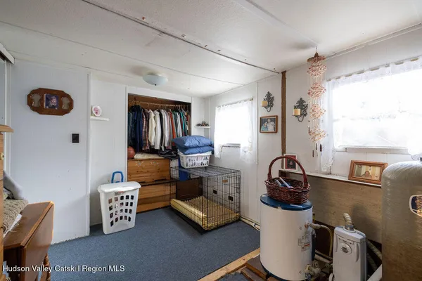 a view of entryway with workspace and a couch