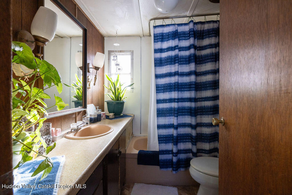 157 Simons Road Ancram, NY 12502 - Photo 15 of 17 a bathroom with a sink a toilet and shower