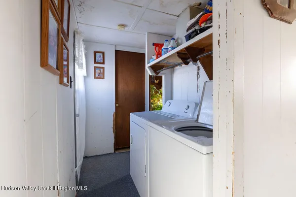 a bedroom with a bed and a dresser in it