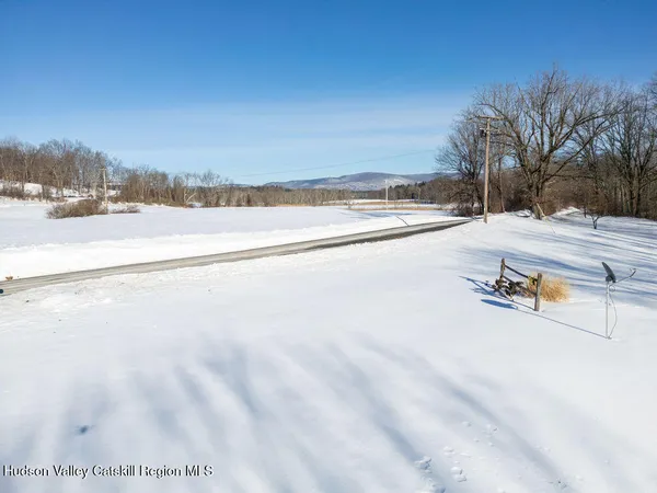 a view of a swimming pool with a yard