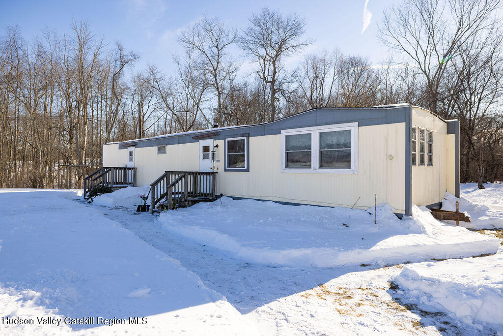 157 Simons Road Ancram, NY 12502 - Photo 7 of 16 a view of a backyard with a large tree