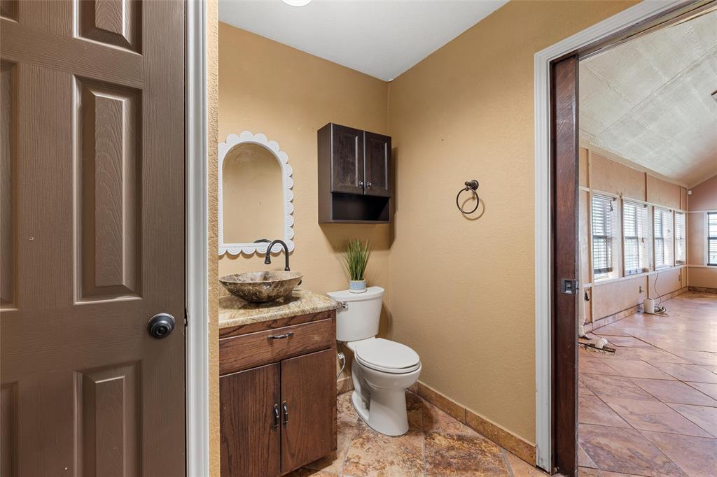 3433 West Tours Road West, TX 76691 - Photo 17 of 40 Half bathroom with vanity and baseboards