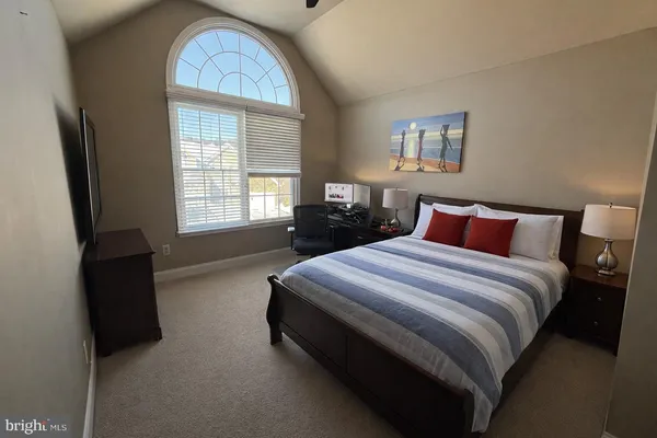a bedroom with bed and window