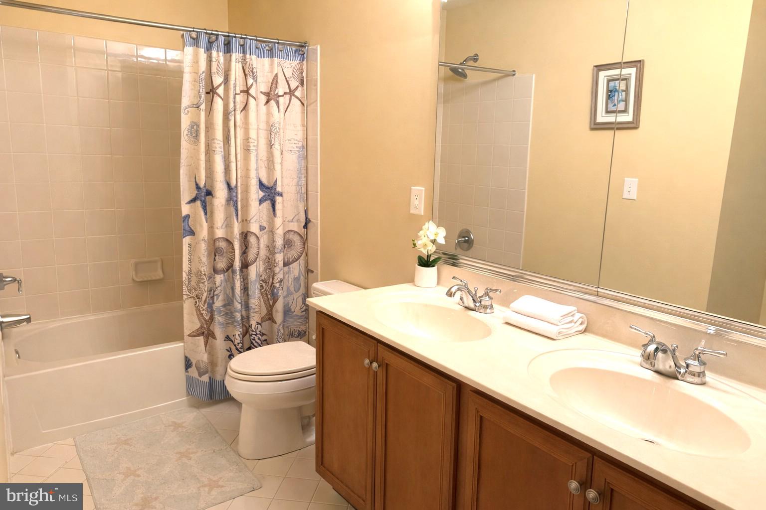 49 Sloan Road West Chester, PA 19382 - Photo 16 of 24 a bathroom with a granite countertop sink toilet and shower