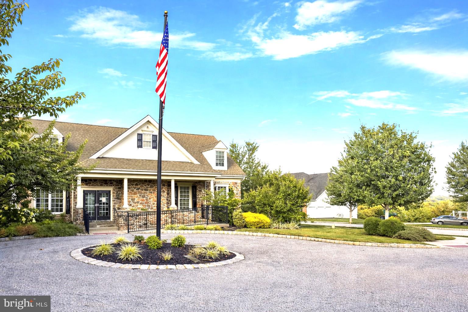49 Sloan Road West Chester, PA 19382 - Photo 19 of 24 a front view of a house with a garden and patio