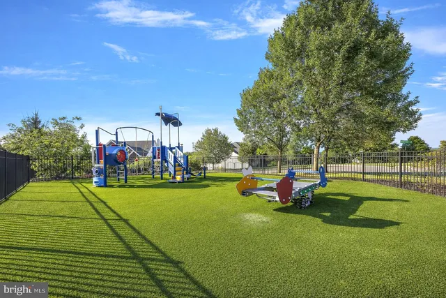 a childrens park with lots of swings and slides