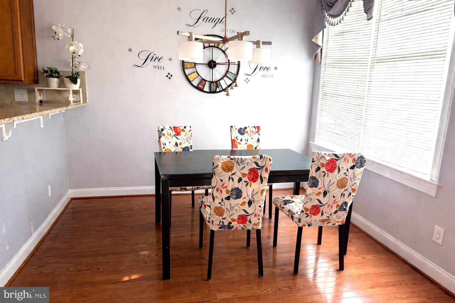 49 Sloan Road West Chester, PA 19382 - Photo 4 of 24 a view of a dining room with furniture and wooden floor