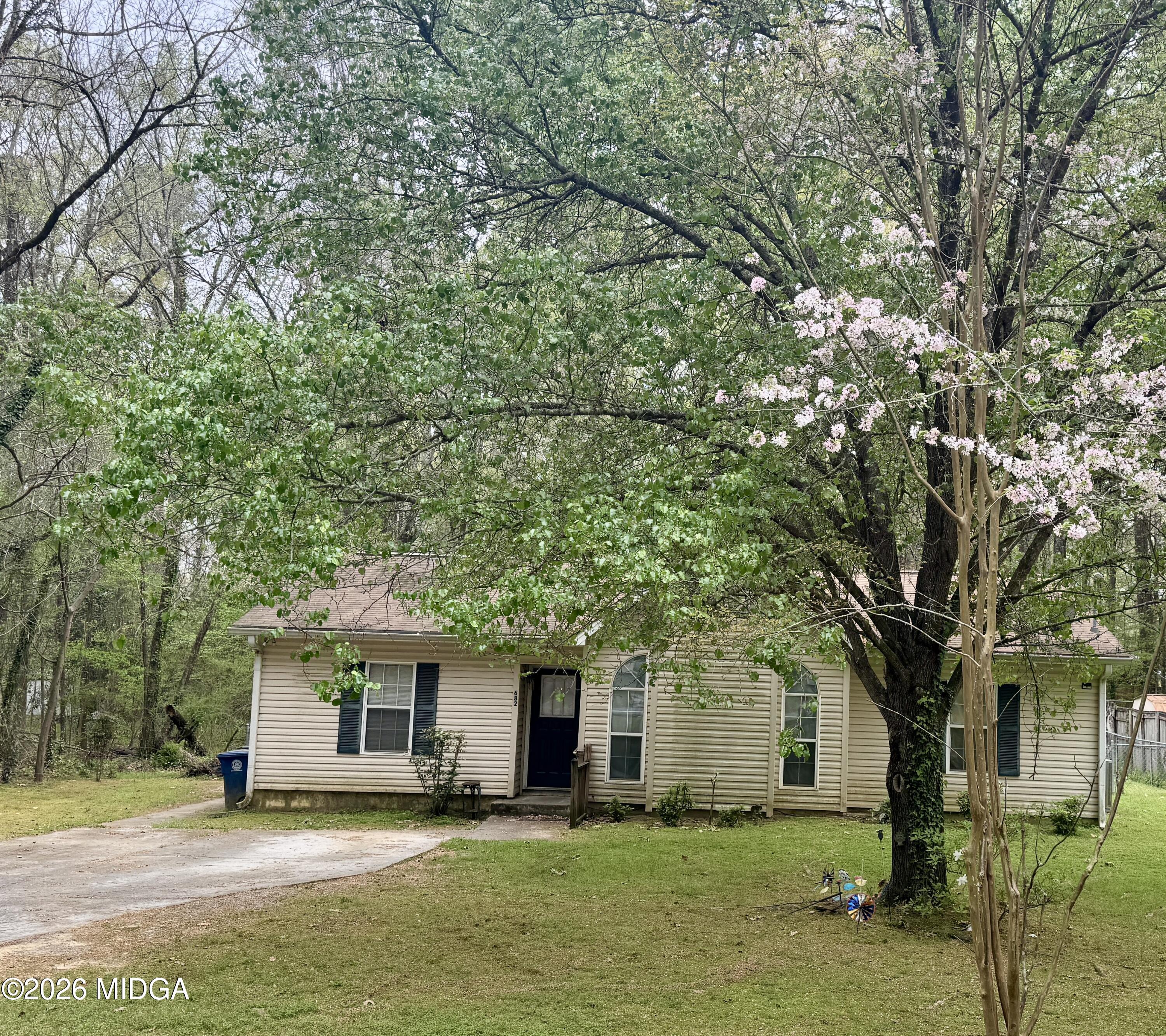 682 Wilderness Drive Macon, GA 31220 - Photo 1 of 25 a front view of a house with yard and trees