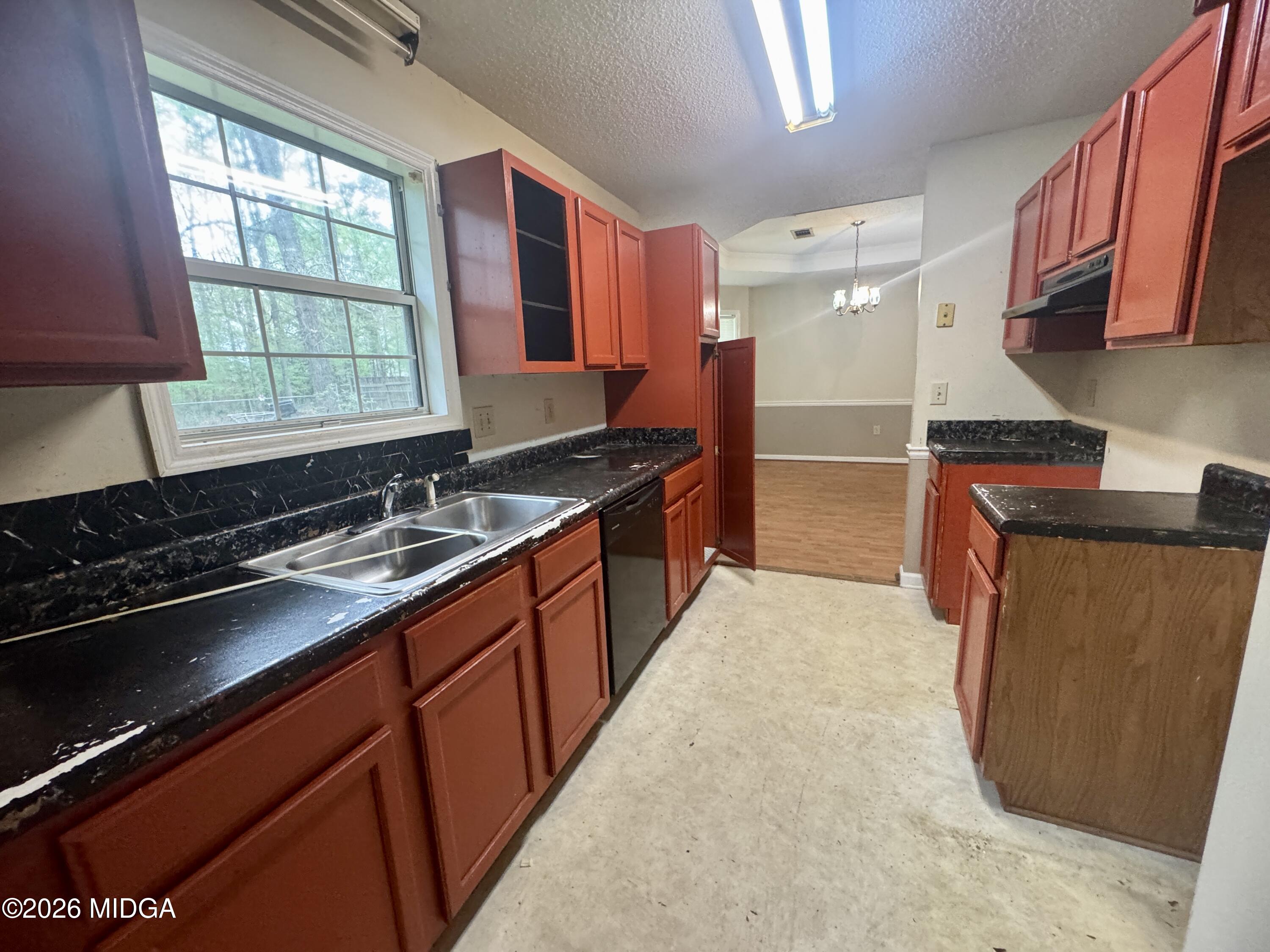 682 Wilderness Drive Macon, GA 31220 - Photo 11 of 25 a kitchen with stainless steel appliances granite countertop a stove a sink and a microwave