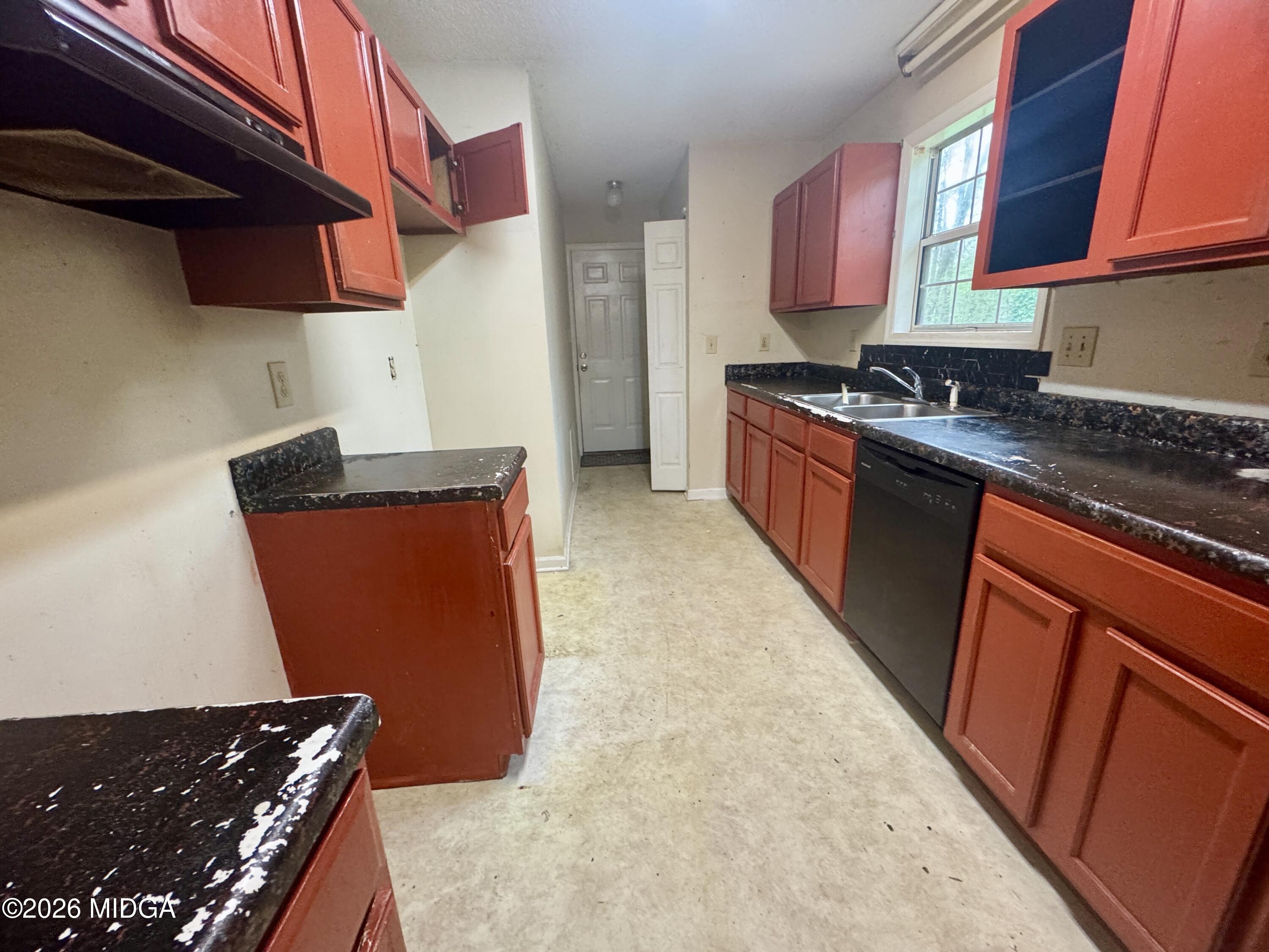 682 Wilderness Drive Macon, GA 31220 - Photo 12 of 25 a kitchen with stainless steel appliances granite countertop a refrigerator and a stove