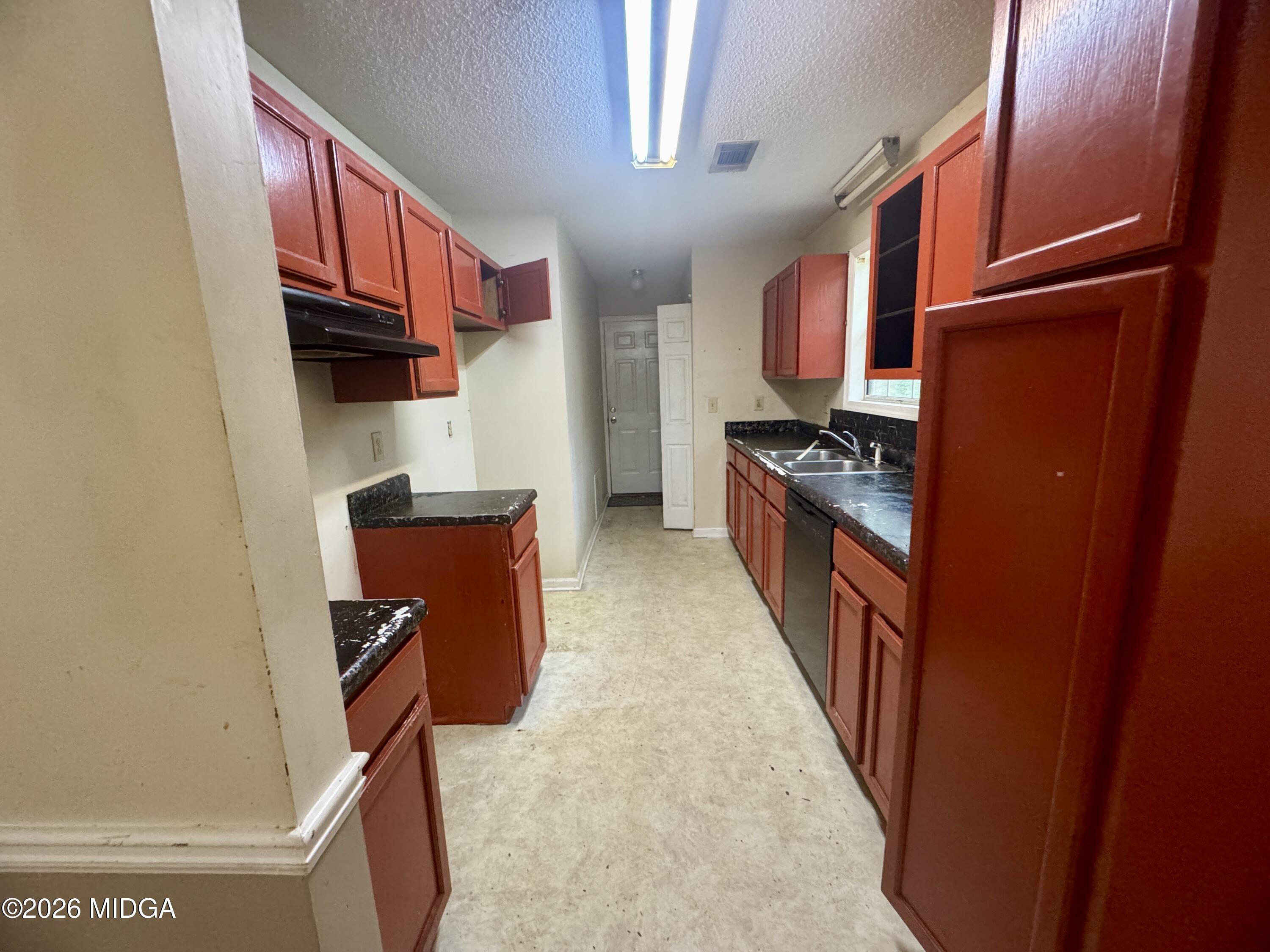 682 Wilderness Drive Macon, GA 31220 - Photo 13 of 25 a kitchen with stainless steel appliances granite countertop a refrigerator a stove top oven a sink and dishwasher