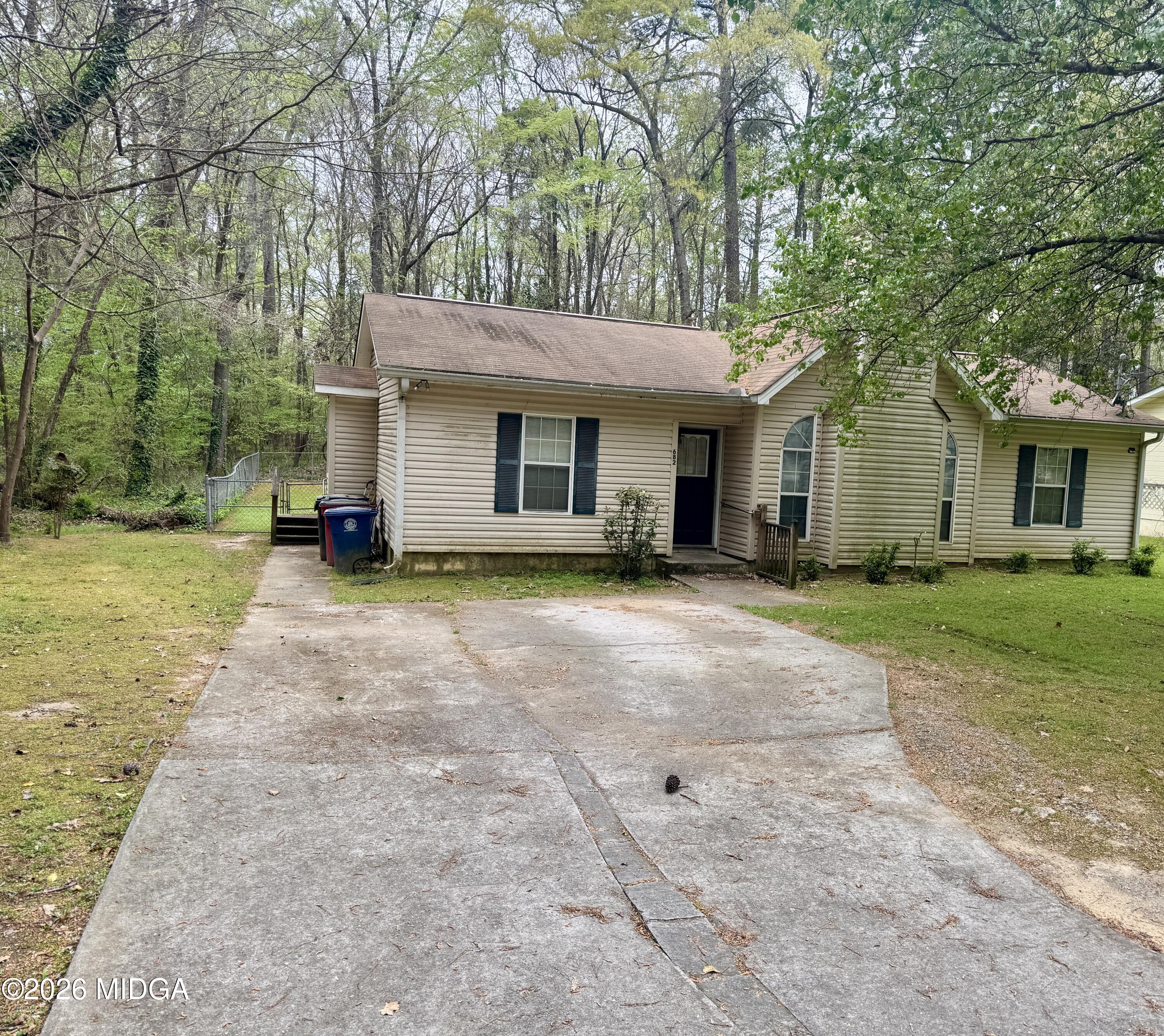 682 Wilderness Drive Macon, GA 31220 - Photo 19 of 25 a front view of house with yard and green space