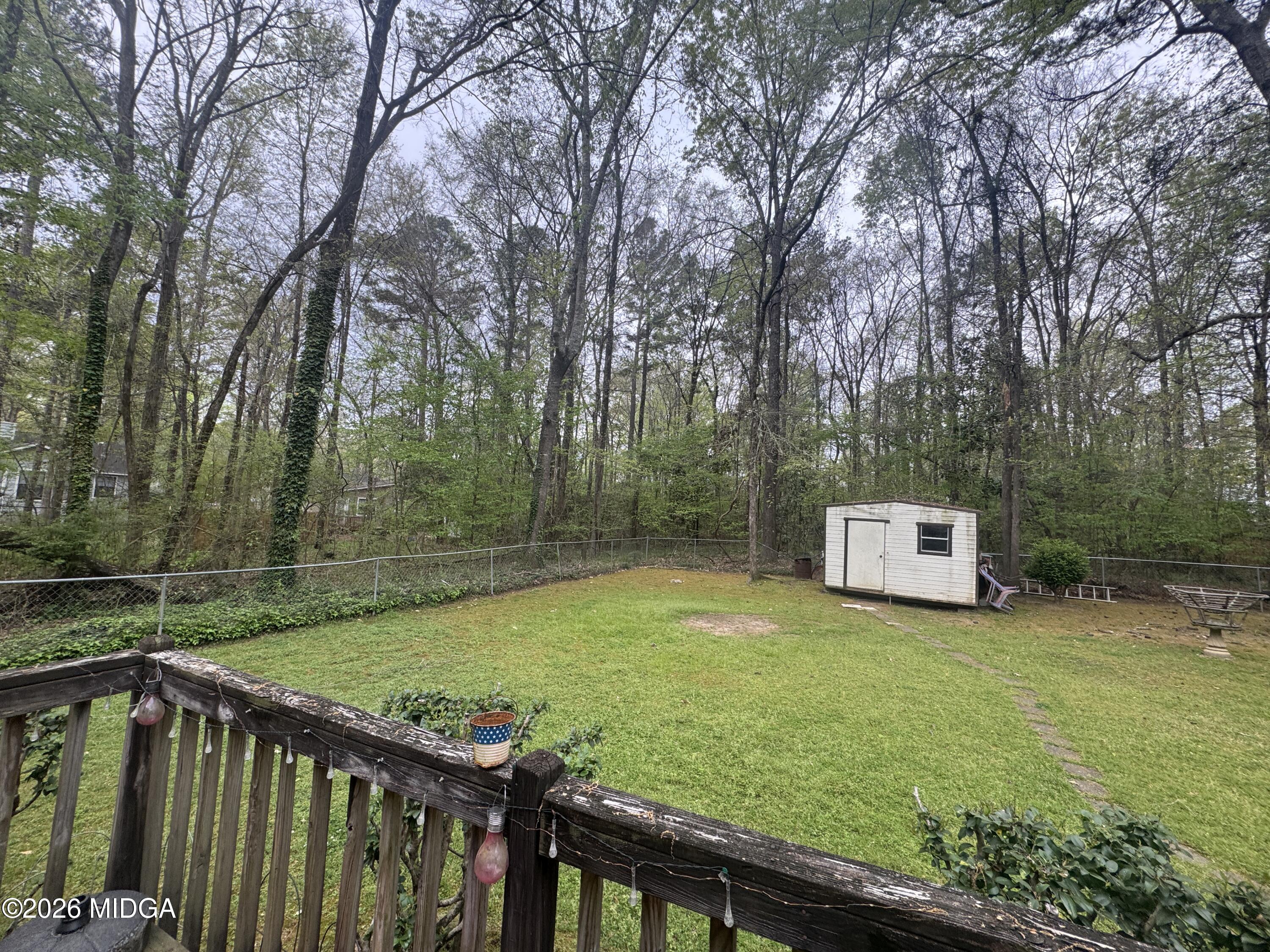 682 Wilderness Drive Macon, GA 31220 - Photo 20 of 25 a view of a backyard with wooden fence