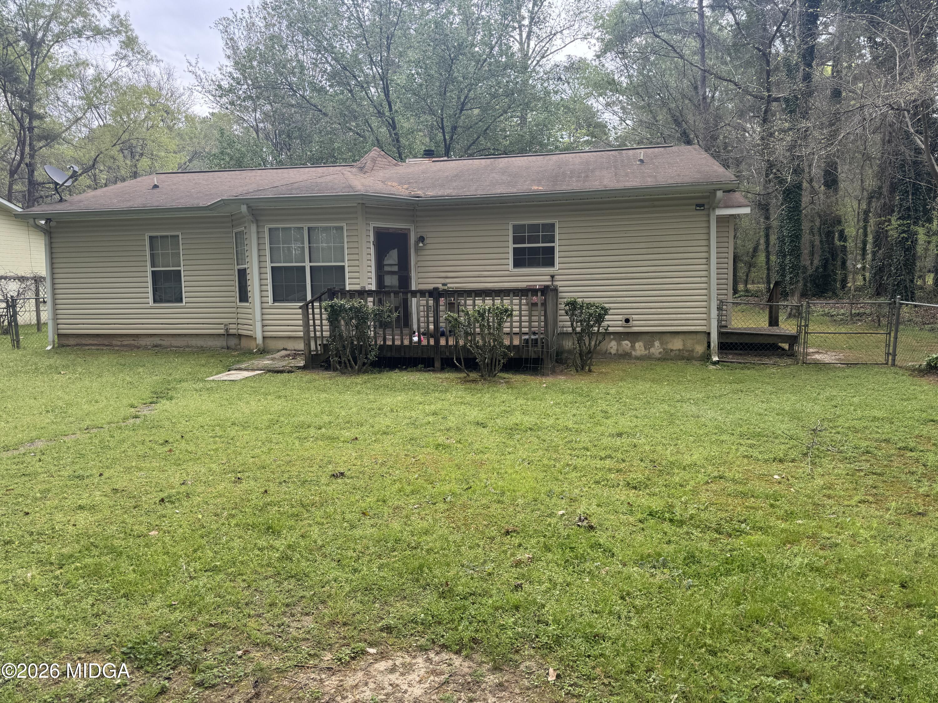 682 Wilderness Drive Macon, GA 31220 - Photo 22 of 25 a view of a house with a yard and sitting area