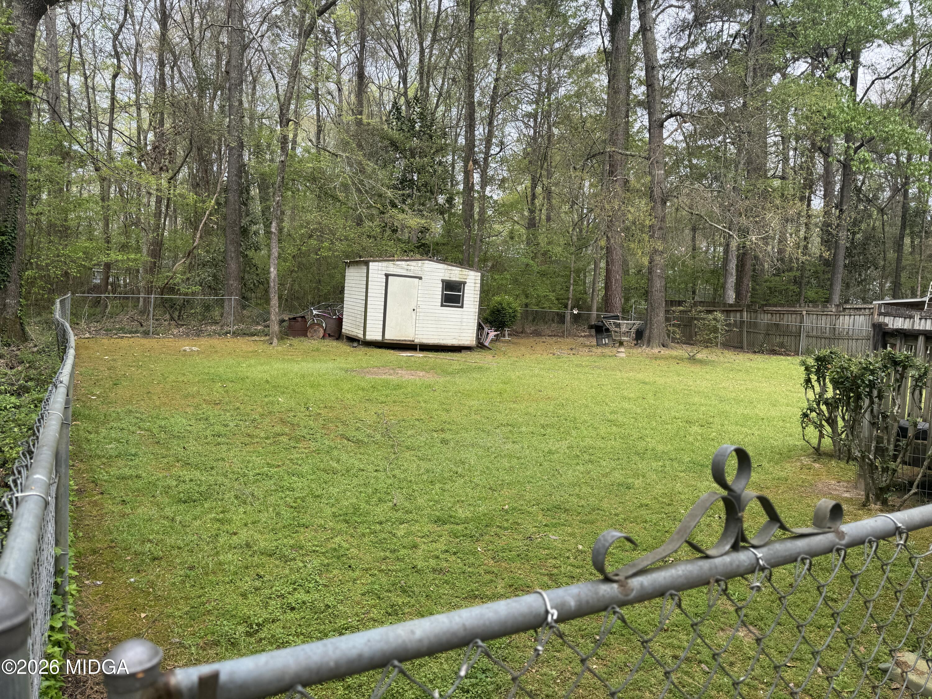 682 Wilderness Drive Macon, GA 31220 - Photo 24 of 25 a view of a pool with a yard