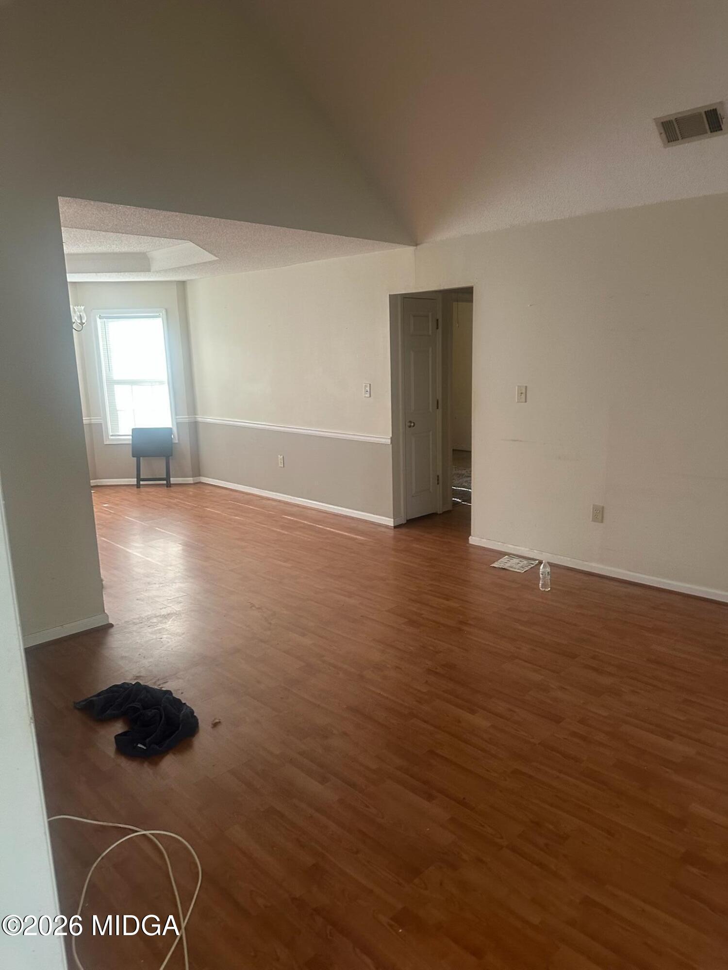 682 Wilderness Drive Macon, GA 31220 - Photo 25 of 25 a view of an empty room with wooden floor and a window