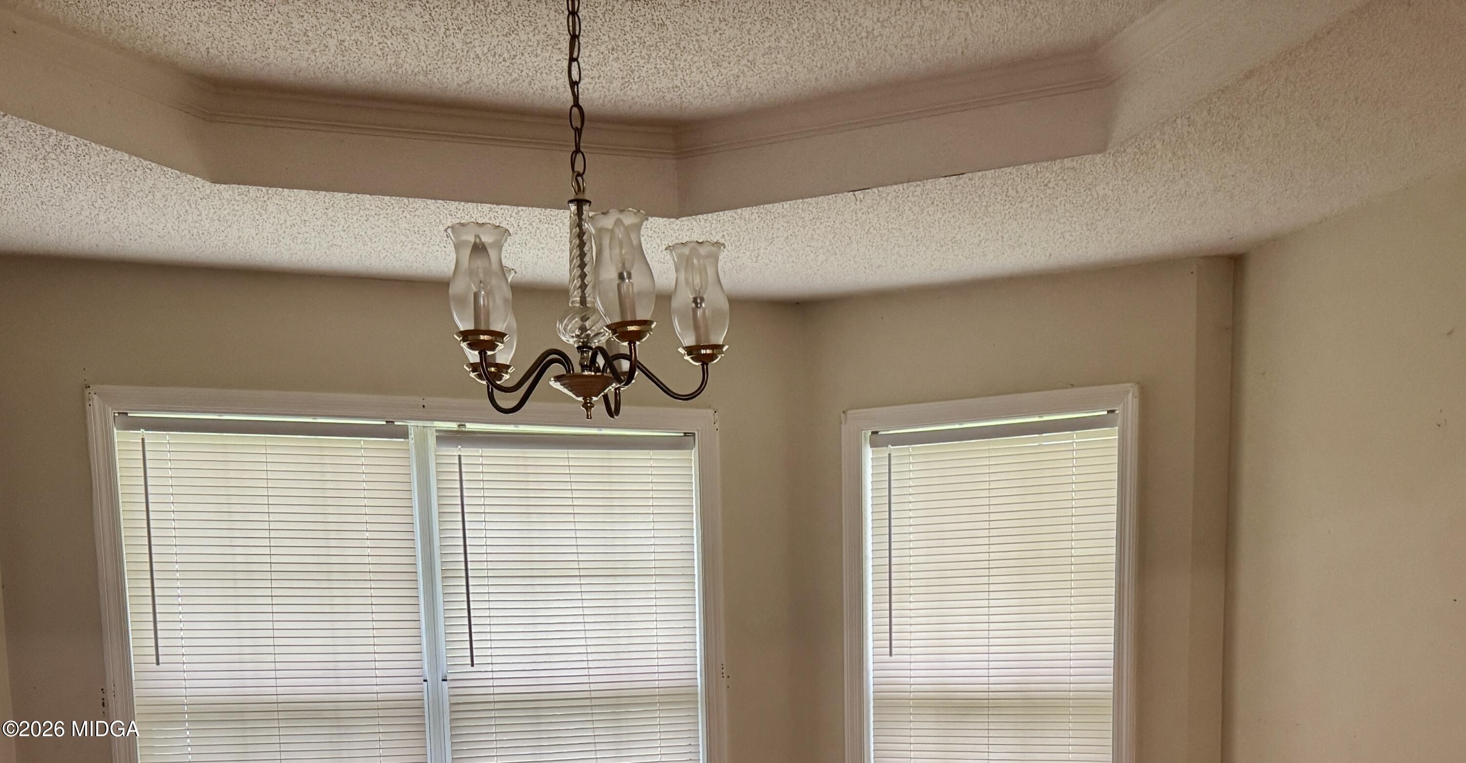 682 Wilderness Drive Macon, GA 31220 - Photo 4 of 25 a view of a room with a window and a chandelier