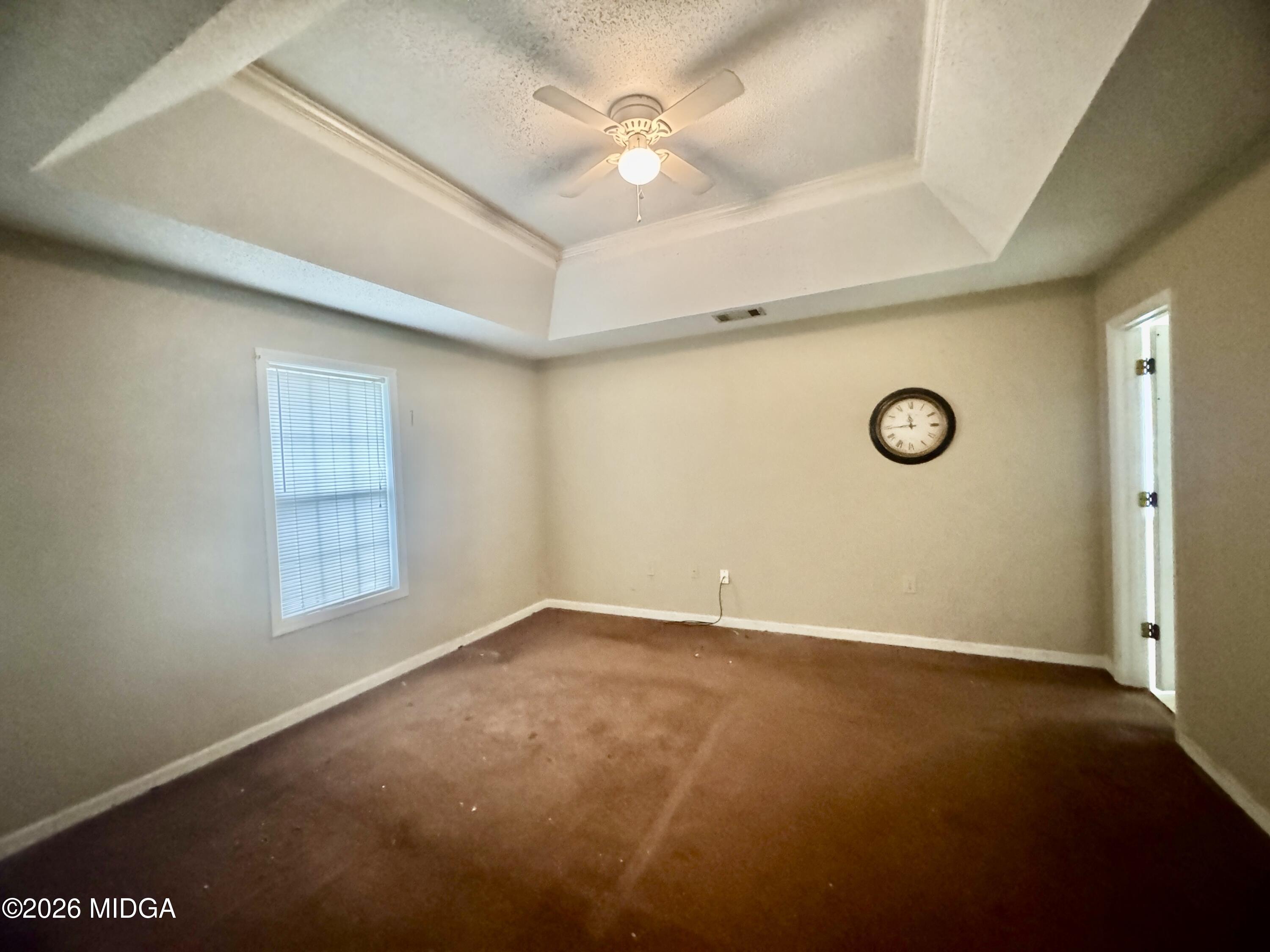 682 Wilderness Drive Macon, GA 31220 - Photo 5 of 25 an empty room with windows and fan