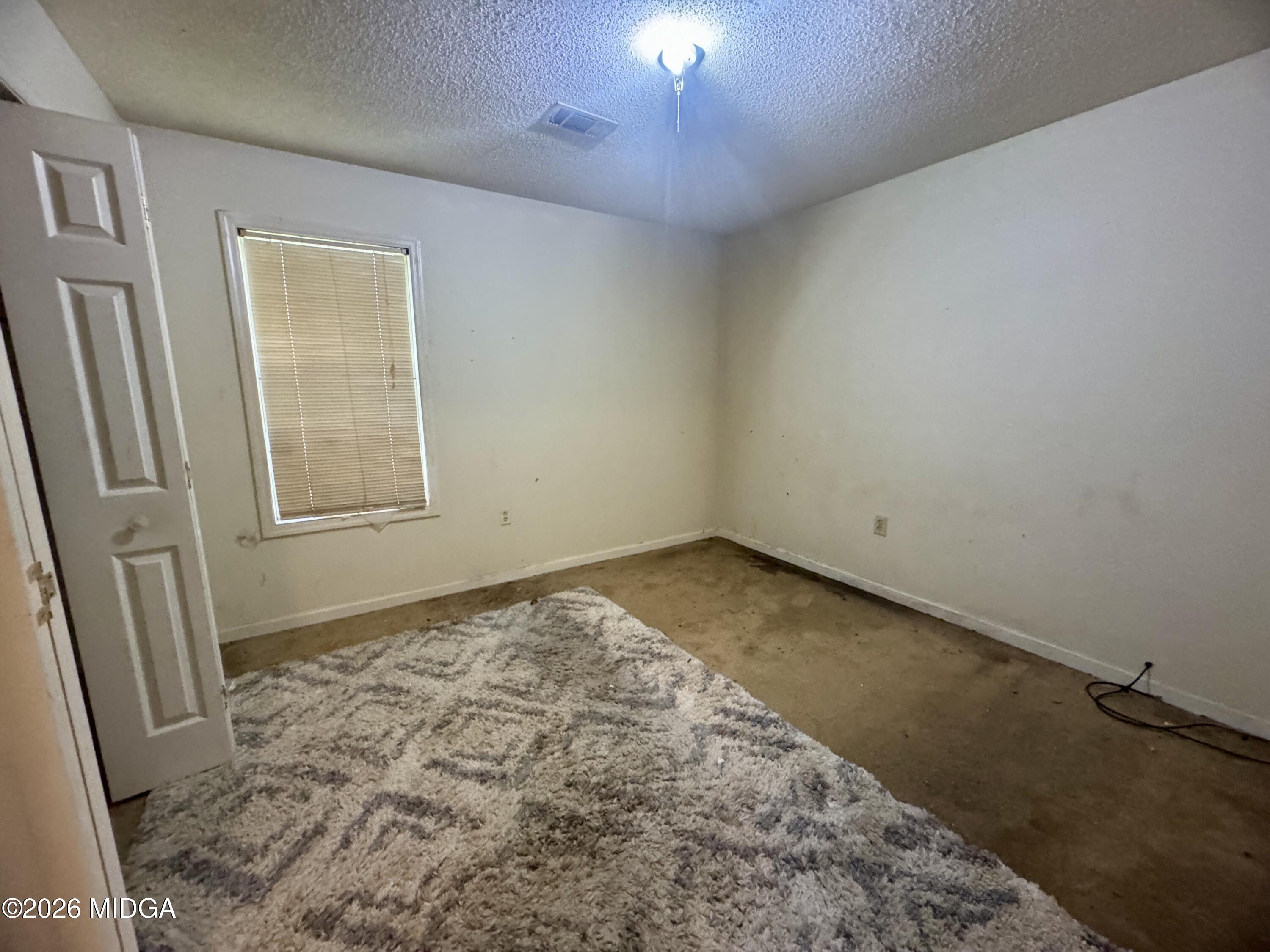 682 Wilderness Drive Macon, GA 31220 - Photo 8 of 25 a view of an empty room and a window