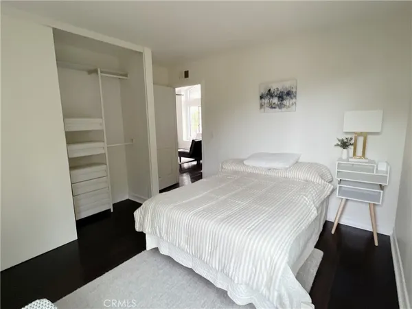 a bedroom with a bed and a closet