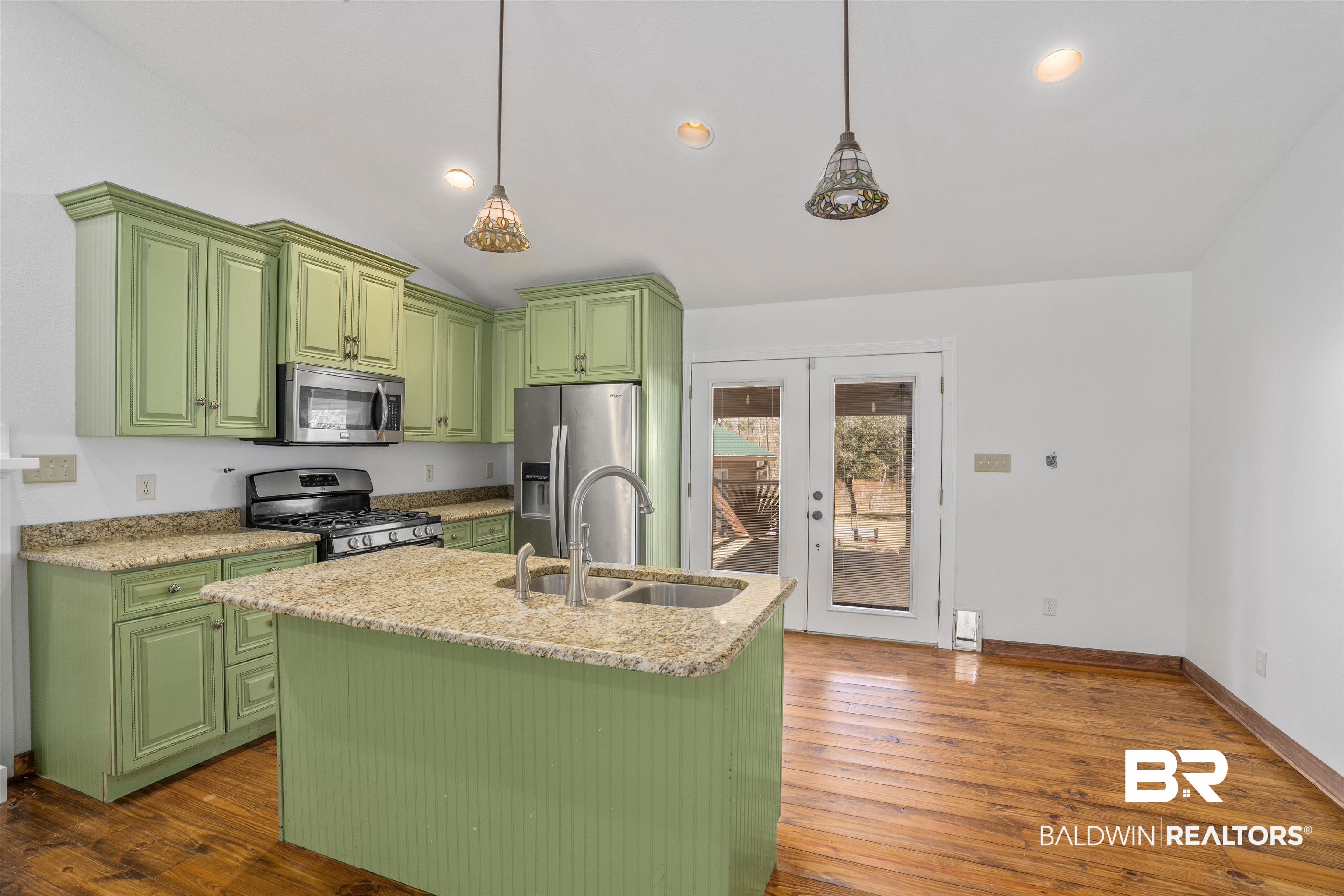 51699 Highway 31 Perdido, AL 36562 - Photo 12 of 30 Kitchen with appliances with stainless steel finishes, a sink, a kitchen island with sink, and pendant lighting
