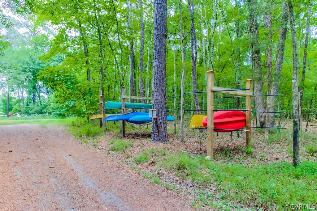 4021 East Old Gun Road Midlothian, VA 23113 - Photo 3 of 12 a backyard of a house with barbeque oven fire pit table and chairs