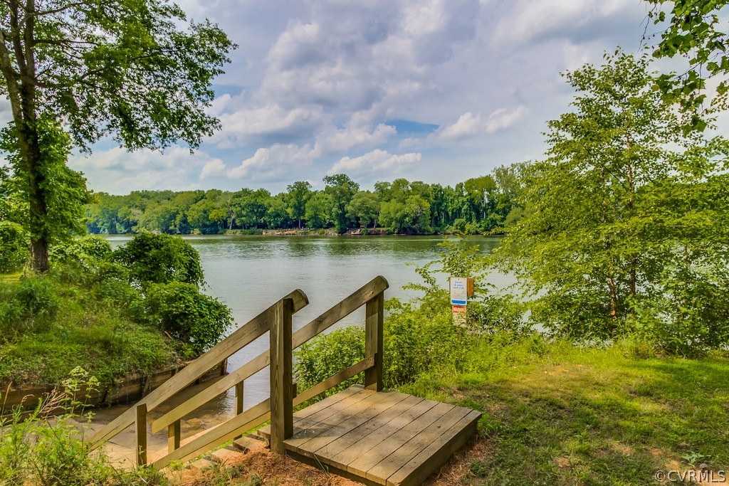 4021 East Old Gun Road Midlothian, VA 23113 - Photo 10 of 12 a view of a lake with a house in the background