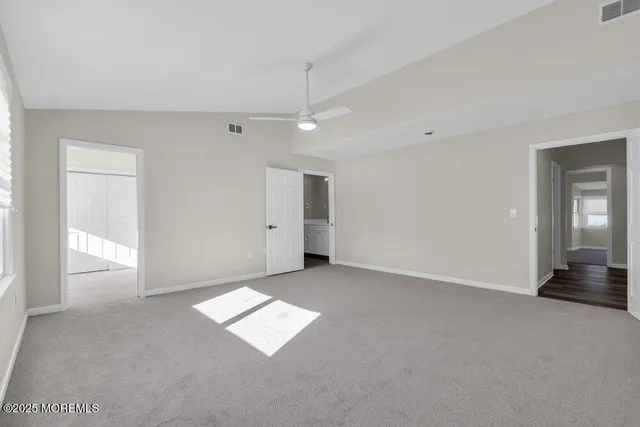 a bathroom with a shower sink and mirror