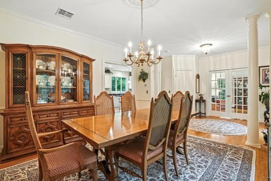 8 Miscoe Hill Road Upton, MA 01568 - Photo 16 of 40 a dining room with furniture a chandelier and wooden floor