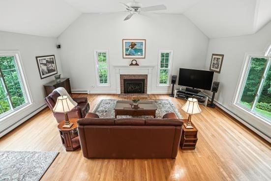 8 Miscoe Hill Road Upton, MA 01568 - Photo 24 of 40 a living room with furniture and a fireplace