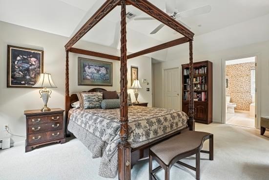 8 Miscoe Hill Road Upton, MA 01568 - Photo 25 of 40 a bedroom with a bed a dresser and a large mirror