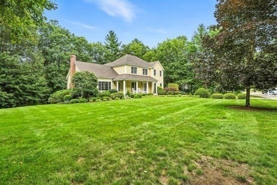 8 Miscoe Hill Road Upton, MA 01568 - Photo 30 of 40 a front view of a house with garden