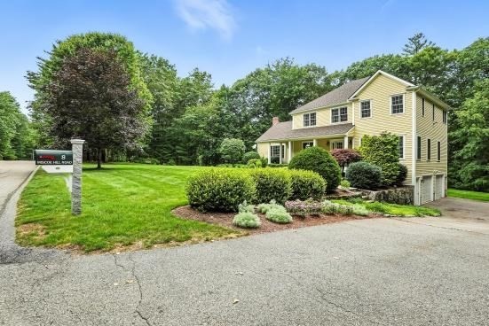 8 Miscoe Hill Road Upton, MA 01568 - Photo 32 of 40 a front view of a house with a yard
