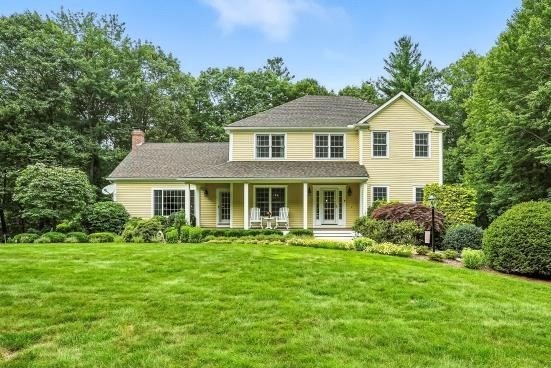 8 Miscoe Hill Road Upton, MA 01568 - Photo 33 of 40 a front view of a house with a yard