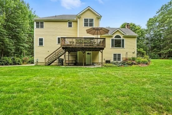 8 Miscoe Hill Road Upton, MA 01568 - Photo 36 of 40 a view of a house with a backyard