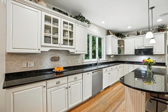 8 Miscoe Hill Road Upton, MA 01568 - Photo 4 of 40 a kitchen with stainless steel appliances granite countertop a sink a stove and cabinets