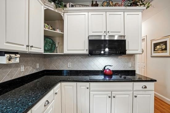 8 Miscoe Hill Road Upton, MA 01568 - Photo 5 of 40 a kitchen with stainless steel appliances granite countertop a sink and a stove